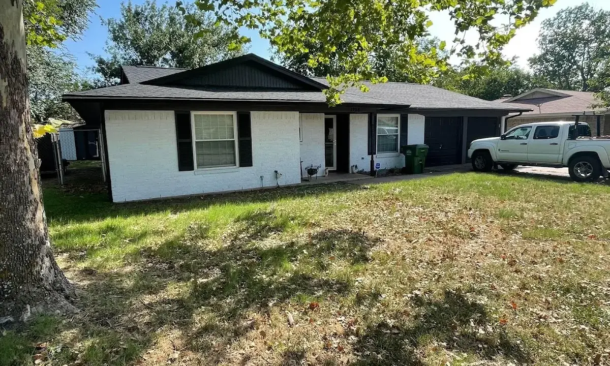 Professional roofing crew working on a residential roof in Greenbelt
